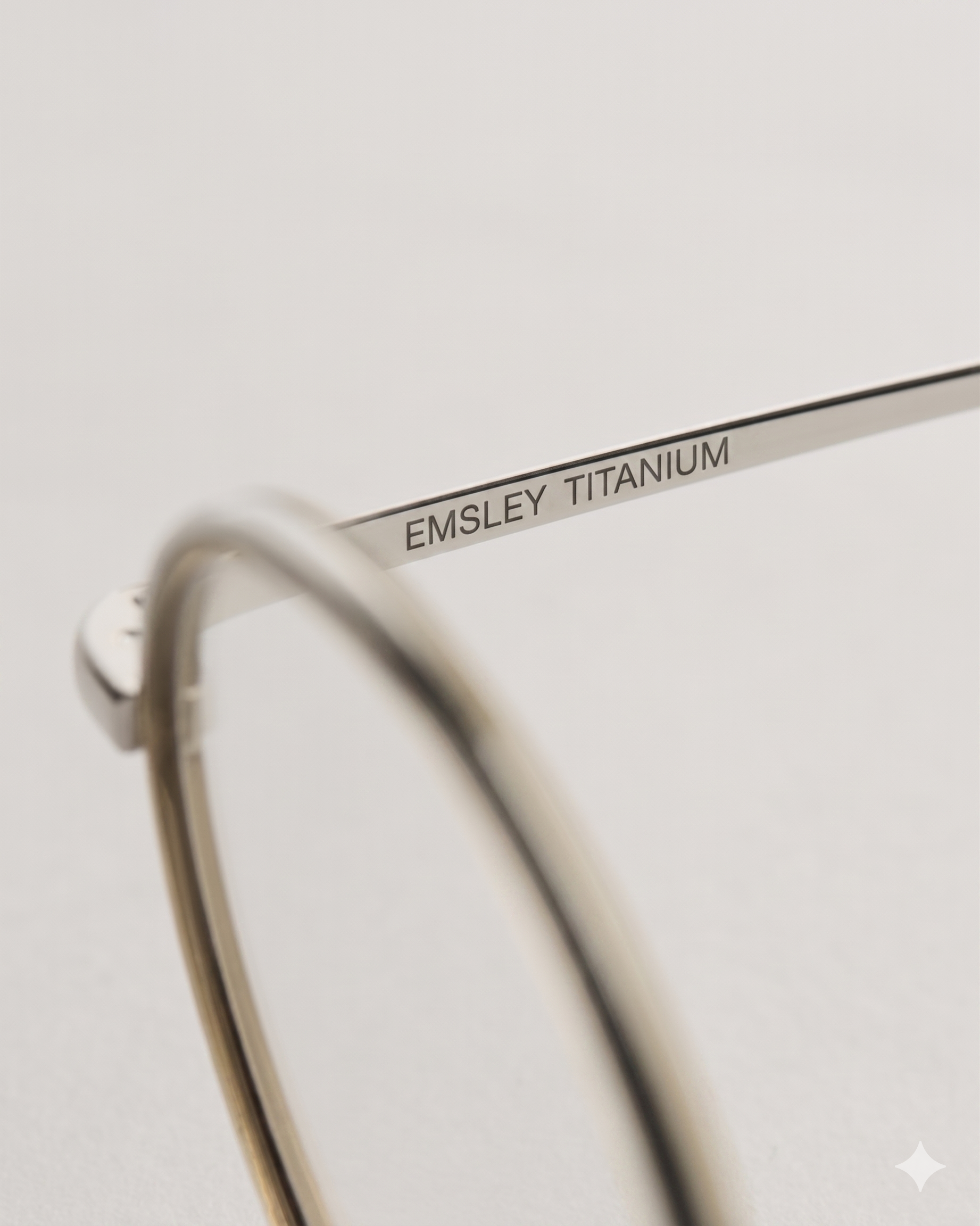 Titanium temple arm with engraved Emsley branding