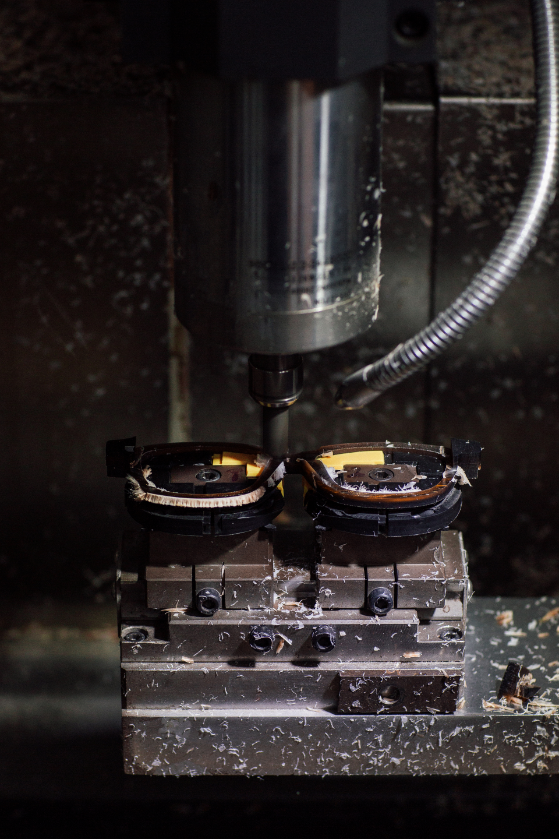 Acetate being machined into frame fronts.