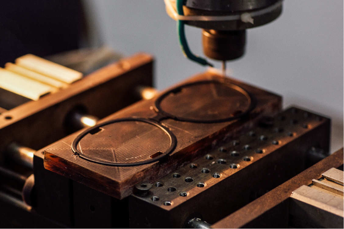 A frame held in a wooden sampling fixture.